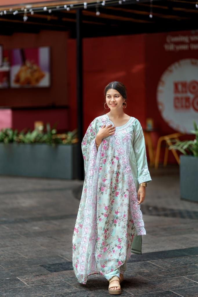 Model wearing the sea mint Mehrin embroidered kurta set with floral dupatta